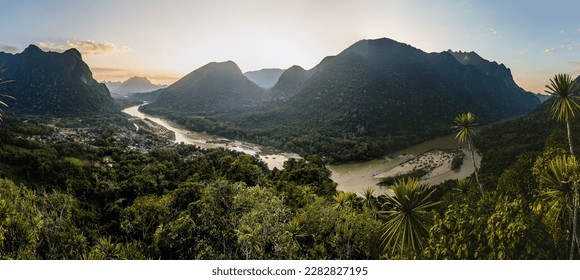 Sunset panoramic view of Muang Ngoi Neua village and Nam Ou river from Phanoi viewpoint, Laos - Shutterstock ID 2282827195