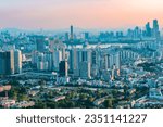 Sunset panoramic view of Seoul city and green forest from Namsan Tower in South Korea