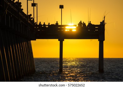 Sunset Passes The Venice Fishing Pier. Venice, Florida