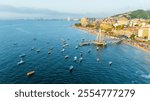 Sunset at the Pier in Puerto Vallarta, Mexico. View of the City and Los Muertos Beach. Copyspace