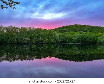 Sunset with pink skies and lake reflection - Powered by Shutterstock
