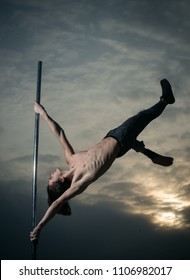 sunset pole dancer. sunset sky with man dancing on pylon - Shutterstock ID 1106982017