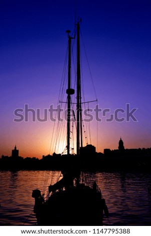 Similar – Silhouette einer ägyptischen Stadt mit Segelboot im Vordergrund und pastellrosa-lila farbenem Himmel, Sonnenuntergangsstimmung