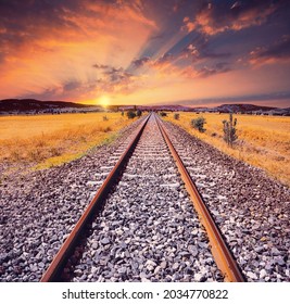 Sunset Railway Line. Train Road. Orange And Red Sun. Rural Area