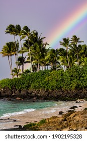 
Sunset With Rainbows, Beautiful Coconut Trees And A Royal Blue Water On The North Shore Of The Oauha Hawaii - HI - USA