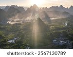 Sunset rays falling to the karst mountains at the Wuzhishan Scenic Area, Cuiping Village, Grape Town, Guilin, Guangxi China