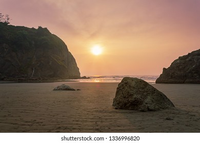 sunset rays shinging over ruby beach in summer afternoon