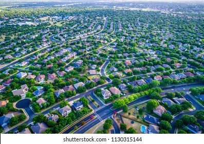 Sunset Real Estate Suburb Homes. Community Suburbia Neighborhood In North Austin In Suburb Round Rock , Texas Aerial Drone View Above New Development High Above Rooftops