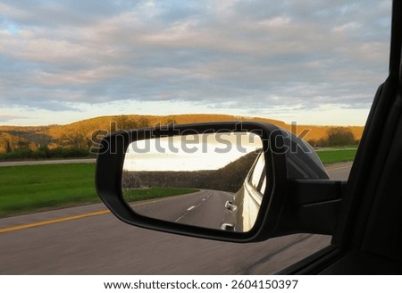 Sunset reflected in car mirror
