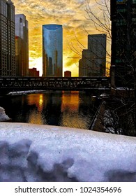 Sunset reflected over Chicago River in winter, with snow covered bannister foreground.