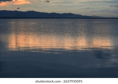 Sunset reflection on water surface