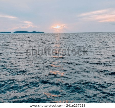 sunset reflection on a wavy sea