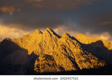Sunset reflection at the top of the mountain Le Grand Bec in French Alps in Savoy.