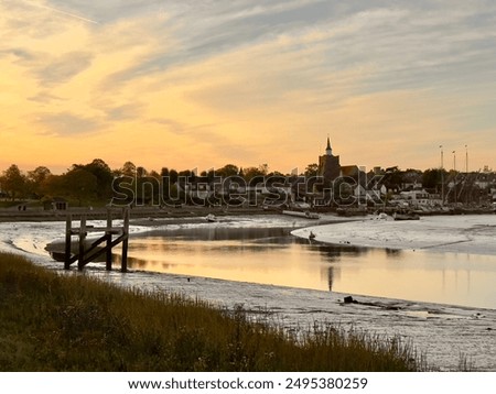 A sunset reflection view of the historic town of Maldon on the River Blackwater in Essex, England.
