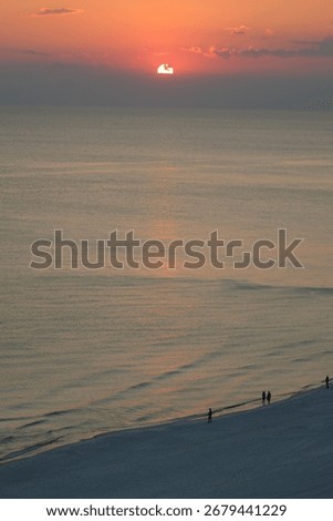 SUNSET RELECTION ON THE BEACH