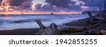 Sunset rialto beach with drift wood and sea stacks along the costline panorama