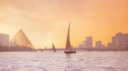 Sunset River Nile With White Yacht Background Egyptian Pyramid Cairo, Egypt.