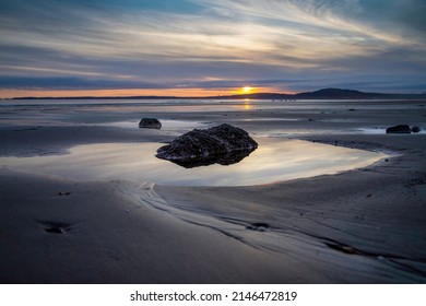 Sunset And Rock Pools At Aberavon Beach In Port Talbot, South Wales UK
