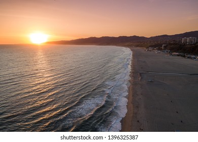 Sunset in Santa Monica, Los Angeles, California. Situated on Santa Monica Bay, it is bordered on three sides by the city of Los Angeles Pacific Palisades, Brentwood, West Los Angeles Mar Vista, Venice - Shutterstock ID 1396325387
