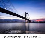 A sunset scene of Kolkata riverfront under the second Hoogly bridge