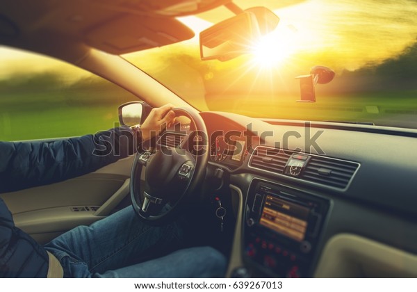 Sunset Scenery\
Car Drive. Wide Angle Car Interior View and the Spring Sunset on\
the Outside. Car Travel\
Concept.