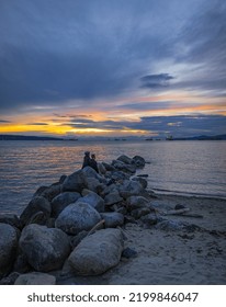 Sunset Scenic Over The Beach With Rocks. Beautiful Sunset At The Pacific Ocean Canada. Travel Photo, Selective Focus, Blurred, Copy Space For Text