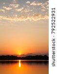 Sunset at the Schell Osage Conservation area located in the Ozarks area in Missouri.  The Lake has a reflection of the glowing sunset.