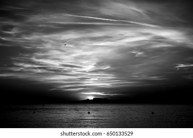 Sunset In The Sea With Amazing Clouds. French Riviera. Black And White Shadow Scene