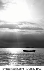 Sunset in the sea with a boat. A picture of a small boat with a beautiful sunset background.