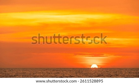 Sunset Sea, Sky clouds sun dawn over sea and fishing boat in the Evening with Orange, Yellow Gold sunlight in Golden hour and Dramatic fluffy, Horizon sea Summer Red sky landscape, Dusk sky background