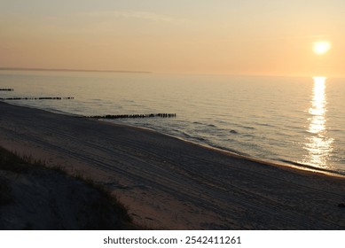 sunset, sea, waves, low tide, stones, sunset at sea, beach, evening, calm, sunset colors, nature, seascape, romance, water, rocky shore, reflection, orange sky, sun, evening light, horizon, relaxation - Powered by Shutterstock