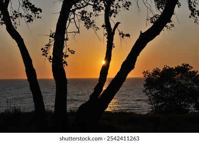 sunset, sea, waves, low tide, stones, sunset at sea, beach, evening, calm, sunset colors, nature, seascape, romance, water, rocky shore, reflection, orange sky, sun, evening light, horizon, relaxation - Powered by Shutterstock