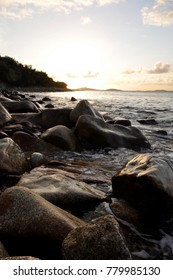 Sunset Seascape Across Rocky Coastline. Isles Of Scilly, Views Across The Sea To Samson Island At Sunset.