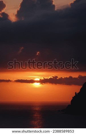 Sunset seen from Ionian Sea coast on near Sinarades village on Corfu Island, Greece