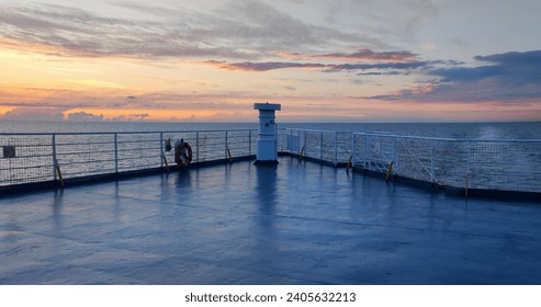 sunset seen from the prow, deck of a passenger ship sailing on a calm sea, silence and peace of the evening, no one, only the beauty of nature, background or wallpaper - Powered by Shutterstock