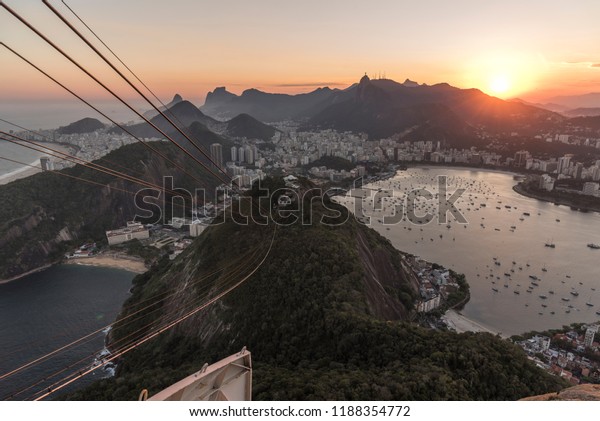 Sunset seen\
from the Sugar Loaf Mountain with beautiful landscape of the city\
and mountains, Rio de Janeiro,\
Brazil