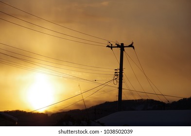 Sunset And Shadow Of Telephone Pole