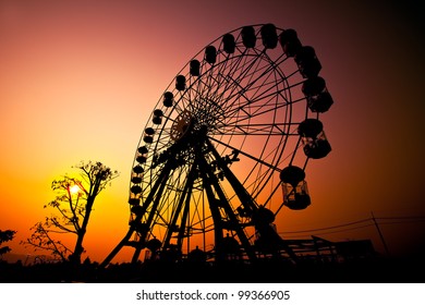 Sunset Silhouette Of Ferris Wheel