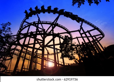 Sunset Silhouette Of A Rollercoaster