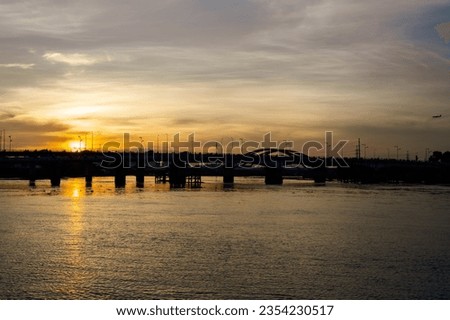 Sunset silhouettes on Binh Trieu bridge in Ho Chi Minh City