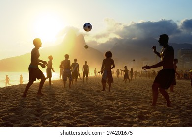 Sunset Silhouettes Playing Altinho Futebol Beach Football Kick-ups Soccer Ball Ipanema Beach Rio De Janeiro Brazil