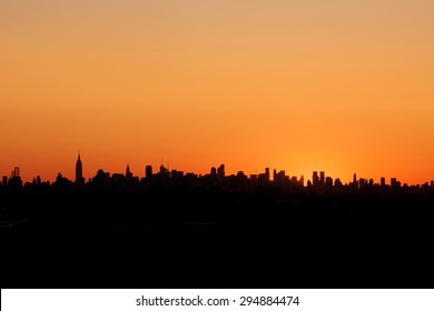 Sunset Sillhouette Of The New York City Skyline. 