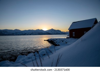 sunset in Skaland on island Senja in northern Norway in winter