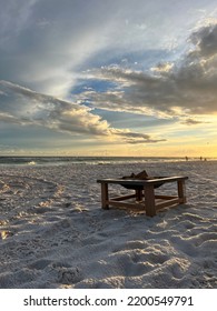 Sunset Skies With Fire Pit On Florida White Sand Beach