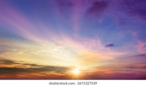 Sunset sky background with clouds and rays of light. Nature composition.
