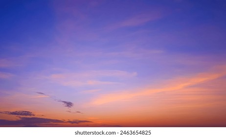 Sunset Sky Background in the Evening with Colorful Orange and Pink Sunlight Clouds on Beautiful Majestic Blue Twilight sky, Summer Sunrise sky Backdrop - Powered by Shutterstock