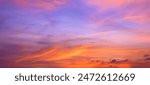 Sunset Sky Background in the Evening with Dramatic Dusk Clouds and Colorful Pink, Orange Sunlight on Blue Twilight sky, Beautiful Summer Sunrise Horizon sky Backdrop, Panoramic View