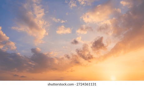 Sunset Sky Cloud Background,Evening Dramatic Dusk sky sun dawn Clouds with Orange,Yellow,Blue warm sunlight in Summer season,Horizon morning Sunrise sky colorful gold beautiful nature sweet Sunshine  