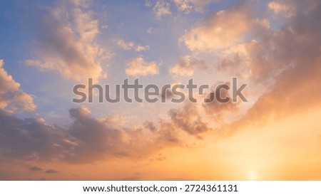Sunset Sky Cloud Background,Evening Dramatic Dusk sky sun dawn Clouds with Orange,Yellow,Blue warm sunlight in Summer season,Horizon morning Sunrise sky colorful gold beautiful nature sweet Sunshine  