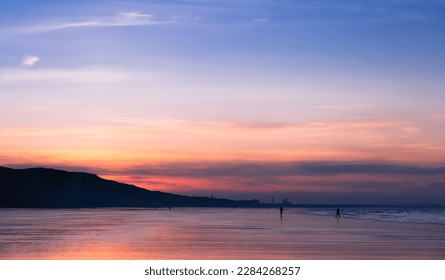 Sunset Sky with cloud over sea sand beach in evening on Spring,Landscape by Seaside with Colourful Sky in Orange,Pink,Purple ,Blue.Golden hour Sunlight reflection on Beach sand on Summer in England - Powered by Shutterstock